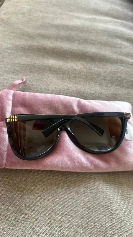 Miu Miu oversized statement sunglasses